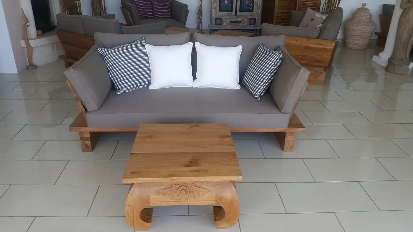 Teak outdoor sofa on a villa terrace