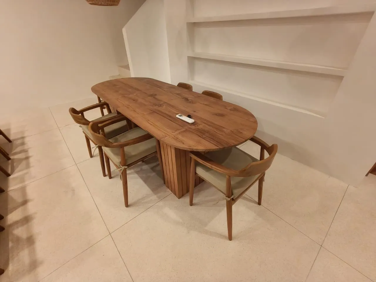 Oval teak dining table and chairs.