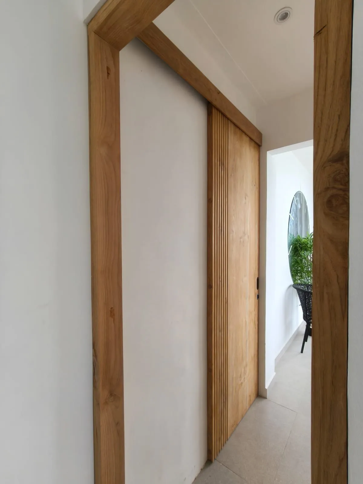 Teak frame and wall detail.
