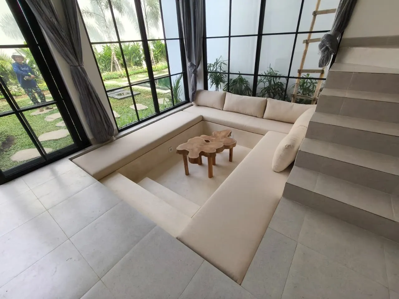 Teak coffee table in a sunken lounge.
