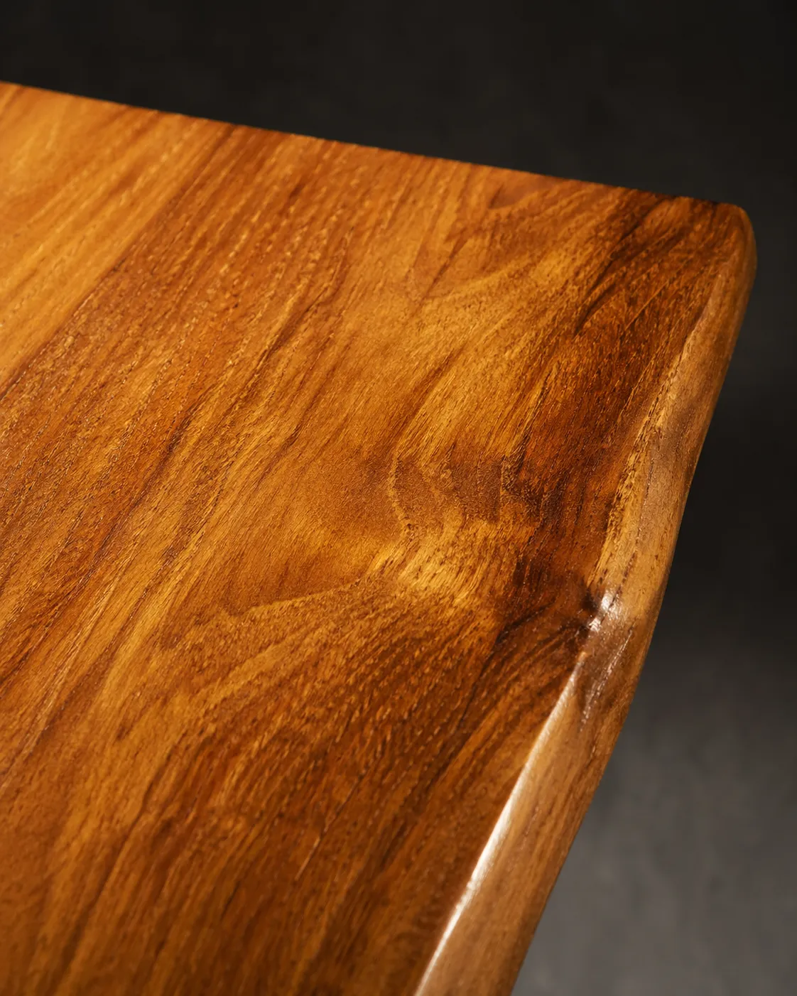 A-grade plantation teak surface detail — Ubud Atelier furniture material sourced from certified Indonesian suppliers